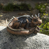 Flower planter pot of reddish-brown dragon curled up, lounging.