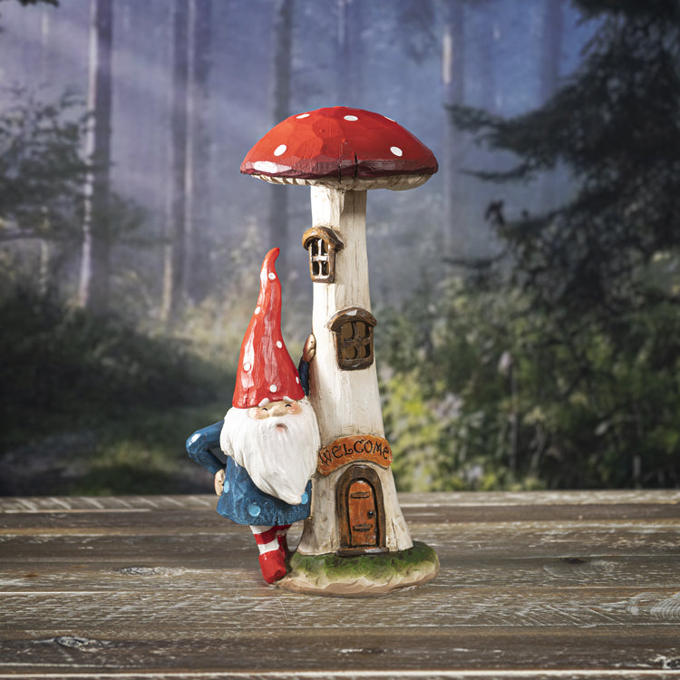 Figurine of mushroom house with windows and gnome in blue and red