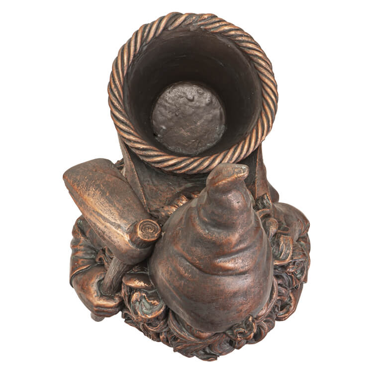 Bronze garden gnome with pickaxe and basket on his back, floral planter