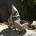 Garden planter pot, bronze gnome pushing an open wheelbarrow