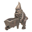 Garden planter pot, bronze gnome pushing an open wheelbarrow