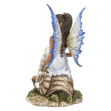 Fairy figurine by Amy Brown, pixie sitting on snail shell, blue tinged wings and striped stockings, back view