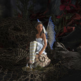 Fairy figurine by Amy Brown, pixie sitting on snail shell, blue tinged wings and striped stockings