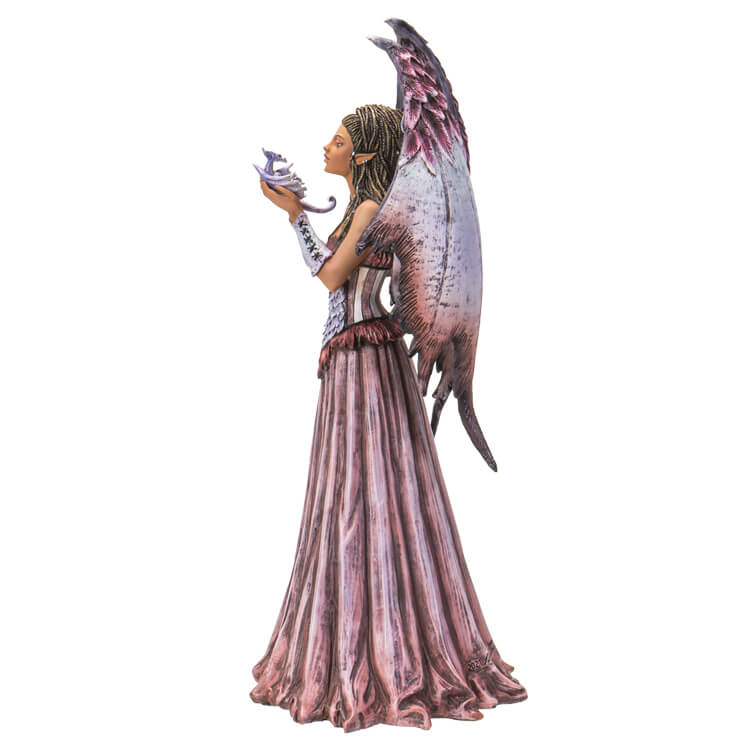 Fairy in pink and baby dragon figurine