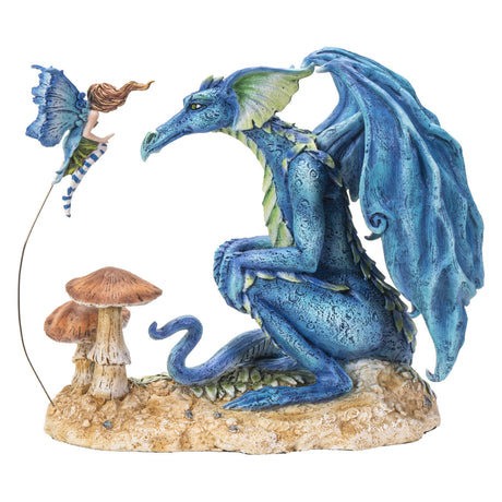 Figurine of a blue dragon and a fairy hovering with blue wings above mushrooms.