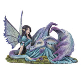 Figurine of a dragon with purple and blue napping on a fairy in a teal dress with black-purple hair