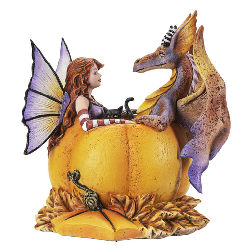 Fairy with red hair, black cat, and orange-purple dragon sitting in a bright orange pumpkin amidst fall leaves