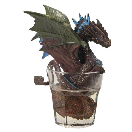 Two headed gin & tonic dragon with blue and brown heads, sitting in glass of clear resin drink