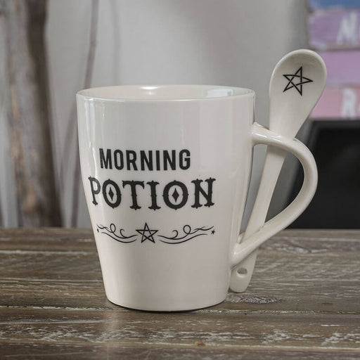 Coffee mug in white with black text, MORNING POTION with spoon
