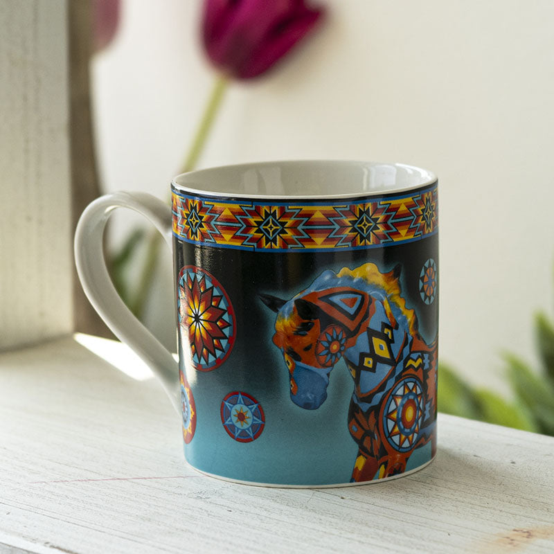 Colorful mug with a horse design and Southwestern patterns on a black background