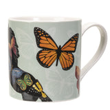 Mug with a design of a horse and butterflies on a light green background