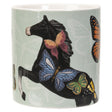 Mug with a design of a horse and butterflies on a light green background