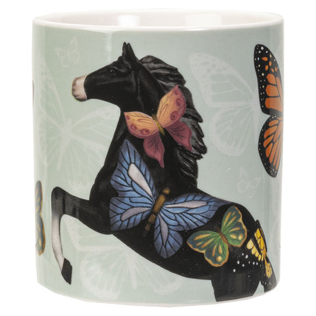 Mug with a design of a horse and butterflies on a light green background