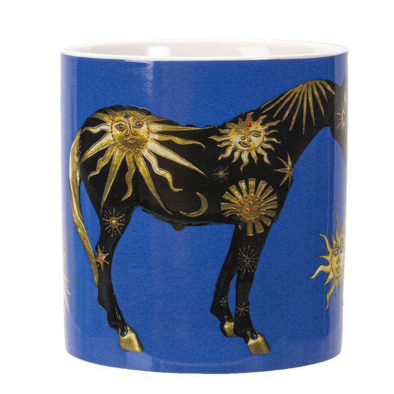 A blue ceramic mug featuring a black horse decorated with gold sun & moon motifs 