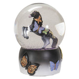 Snowglobe with black rearing horse and butterfly designs with purple glitter in the globe, and a base of black and white with more butterflies