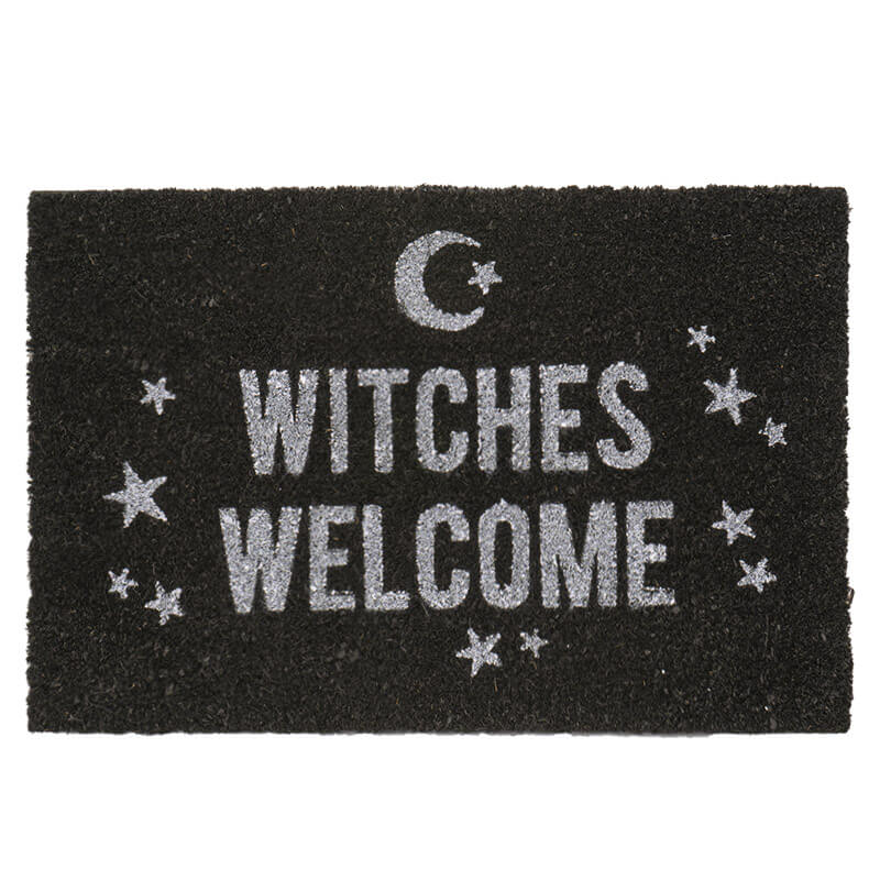 Black doormat with text of "WITCHES WELCOME" in white with stars and a moon