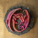 Lammas dragon plaque featuring a magenta and red dragon on a black wheel with runic symbols