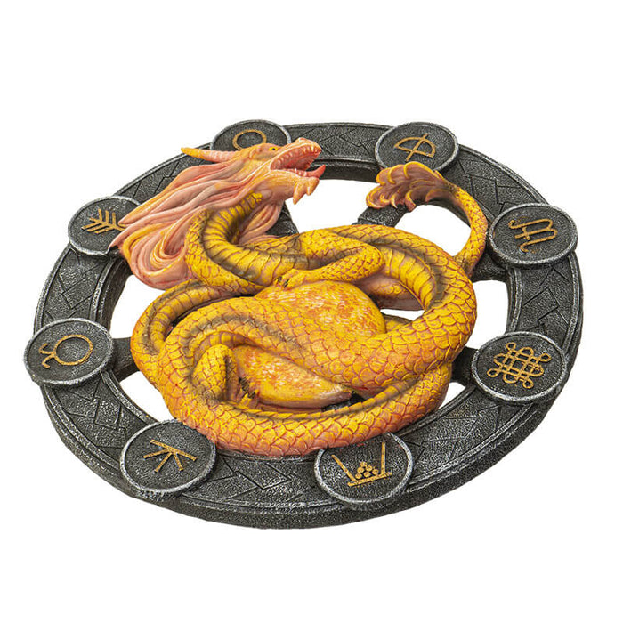 Litha dragon in yellow and orange upon a black wheel with gold symbols