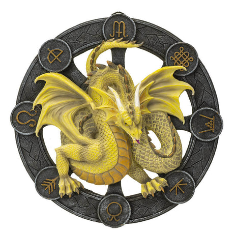 Yellow Mabon dragon on a black wheel with gold symbols