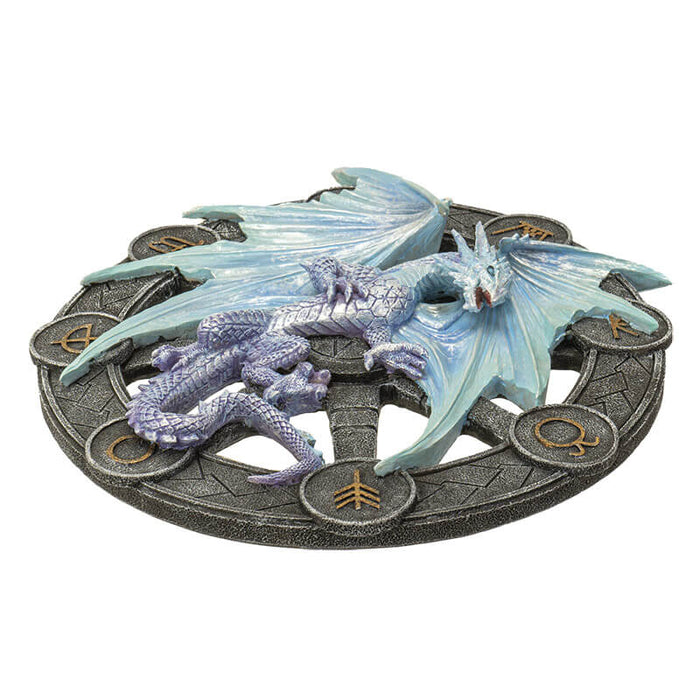 Icy blue silver dragon representing Yule on a black wheel with gold symbols