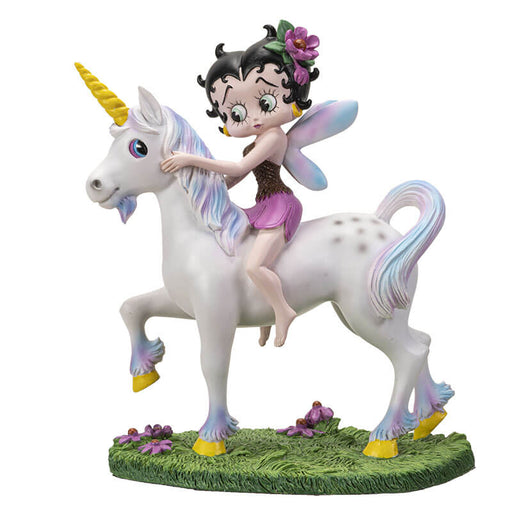 Figurine of Betty Boop with fairy wings and purple flowers in her hair, riding a unicorn in a grassy meadow 