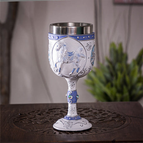 Goblet with stainless steel insert featuring a white horse with blue accents and silver snowflakes, jewels on the drinkware's stem