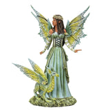 Figurine of a fairy dressed in green with matching wings and dragon. She has tanned skin and braided brown hair.