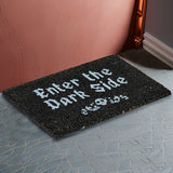 Black doormat with phrase "Enter the Dark Side" and skull design