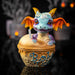 Figurine of blue dragon with red and gold accents sitting in Boba Tea (labeled in blue)