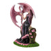 Figurine based on the artwork of Anne Stokes - woman in black and pink dress sitting on a bench with roses, holding the claw of a pink dragon