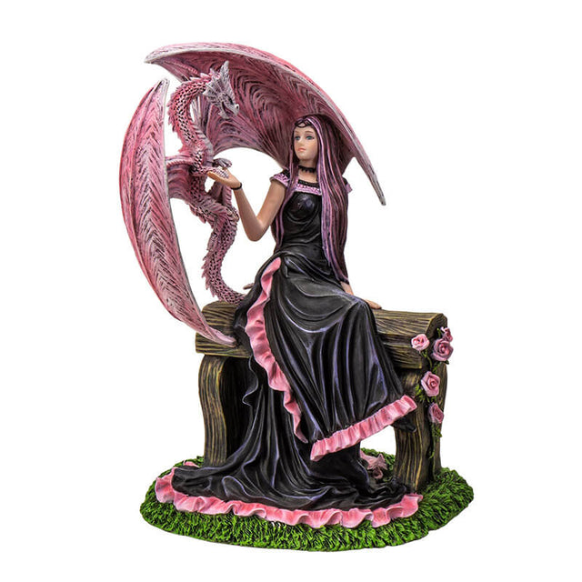 Figurine based on the artwork of Anne Stokes - woman in black and pink dress sitting on a bench with roses, holding the claw of a pink dragon