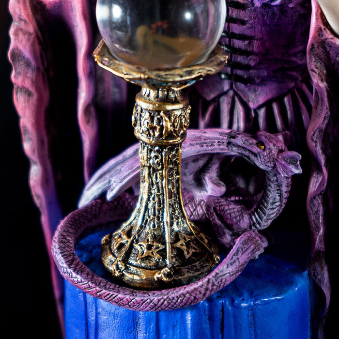 Closeup oif the purple dragon curled around crystal ball's base