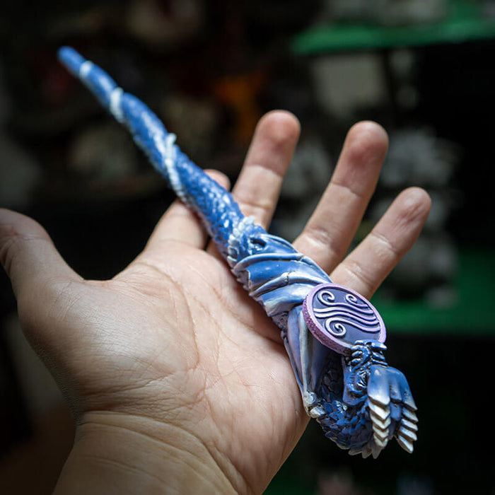 Magic wand with a dragon curled around it in shades of blue and purple with air emblem