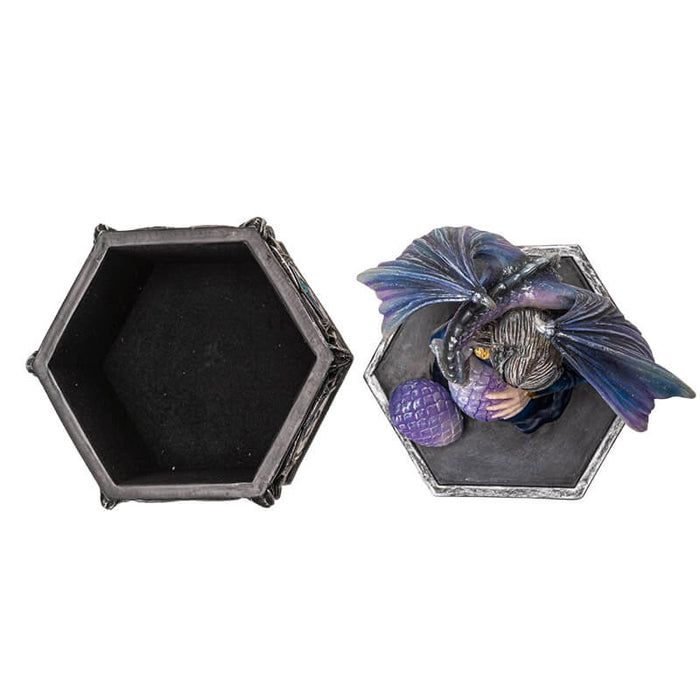 Trinket box with woman holding dragon egg on the lid, a dragon with purple-blue scales wrapped around her. Base of the box has purple and violet dragon designs. Shown top down with lid off