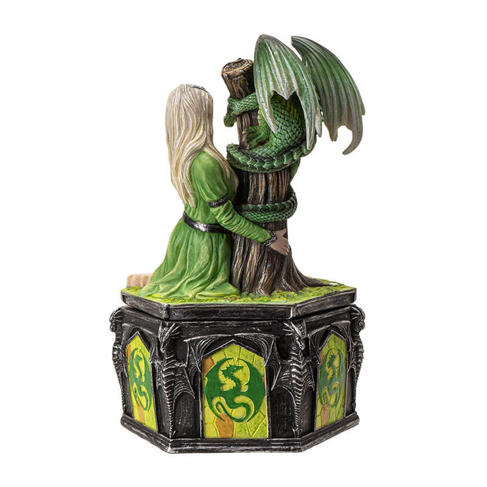 Trinket box with lid featuring blond woman in green dress with emerald dragon wrapped around tree trunk, and dragon designs around the base of the box. Shown from the back.