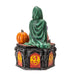 Trinket box, lid has a woman in a green cloak and pink dress cuddling a purple dragon, with a pumpkin. Outer rim of box has red and yellow dragon designs. Shown from the back
