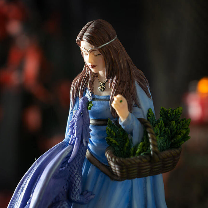 Closeup of woman with basket of greenery and purple dragon