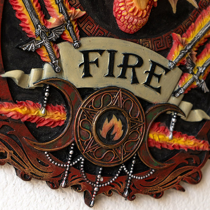 Closeup of "FIRE" with triple moon design and sword hilts