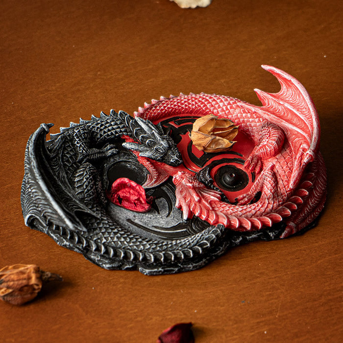 Incense burner with red and black dragons forming an infinity sign. Space for stick and cone incense.