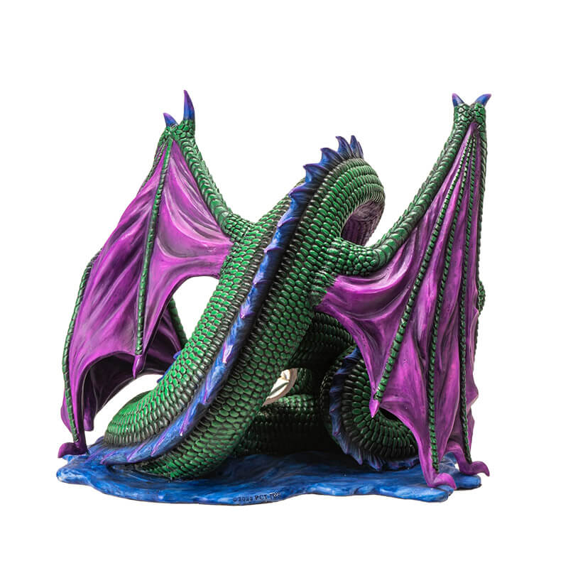 Figurine of green dragon with purple wings and blue spines on a water base with a rune at the center of its coils. View from the back