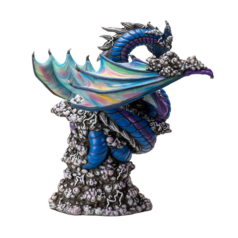 Figurine of dragon in blue and purple, rainbow wings, gray bubbles