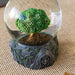 Snowglobe with a tree of life inside, and maiden, mother & crone Triple Goddess design around the faux-stone base.