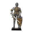 Figurine of knight in silver and gold armor with sword and lion rampant shield