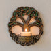 Tree of Life candleholder wall plaque with Celtic knot designs  and spiral, shown with glowing candle