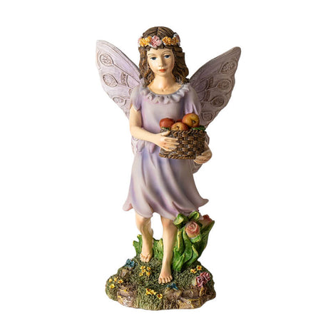 Figurine of a fairy with brown hair and flower crown carrying a basket of apples.