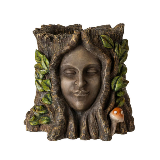 Flower planter of a tree ent, serene face surrounded by leaves and mushrooms on a faux-tree