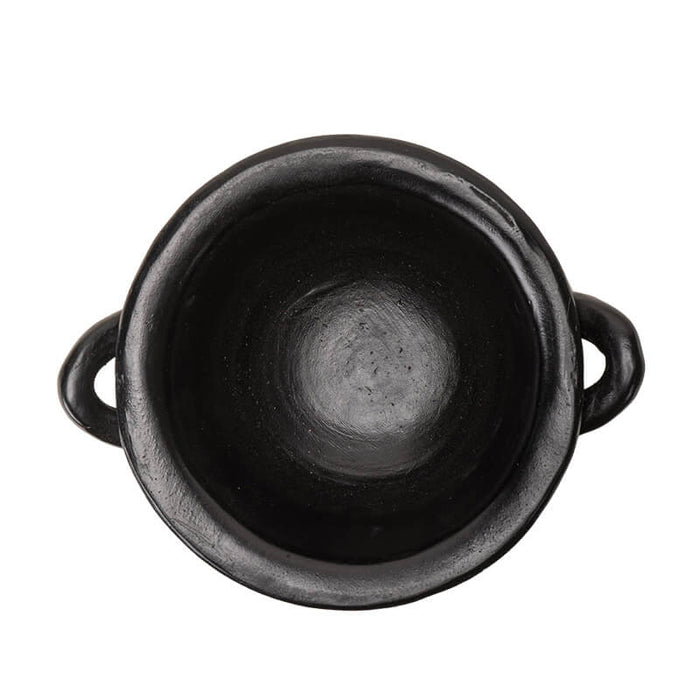 Top down view into black cauldron