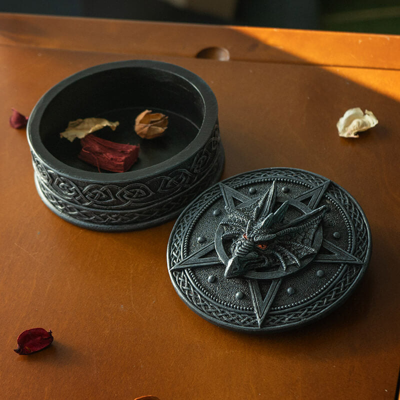 Faux-stone grey trinket box with pentacle, dragon, and Celtic knot designs. Shown open