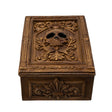 Tarot or trinket box in brown hue with skull and elaborate designs on lid, more fleur de lis emblems on the side.