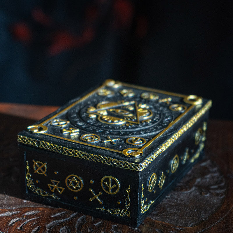 Trinket box in black and gold with Eye of Providence design and arcane symbols